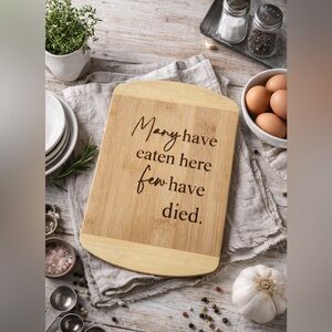 Engraved Bamboo Cutting Board – “Many Have Eaten Here Few Have Died”